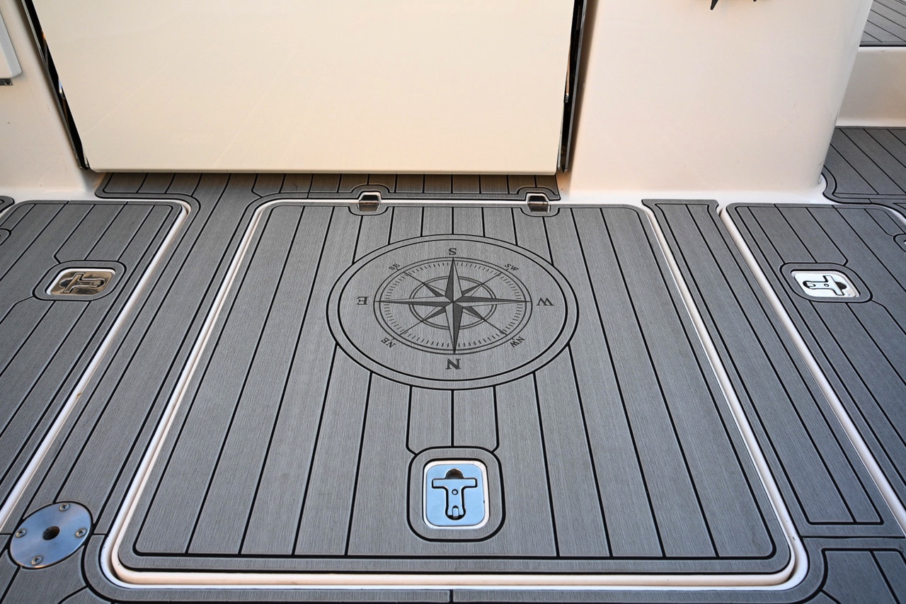 Pursuit EVA flooring compass logo detail